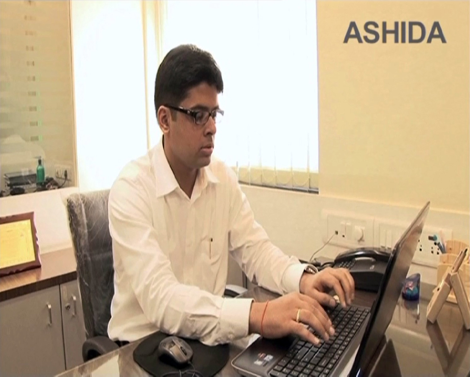 Ashida Electronics Employee working